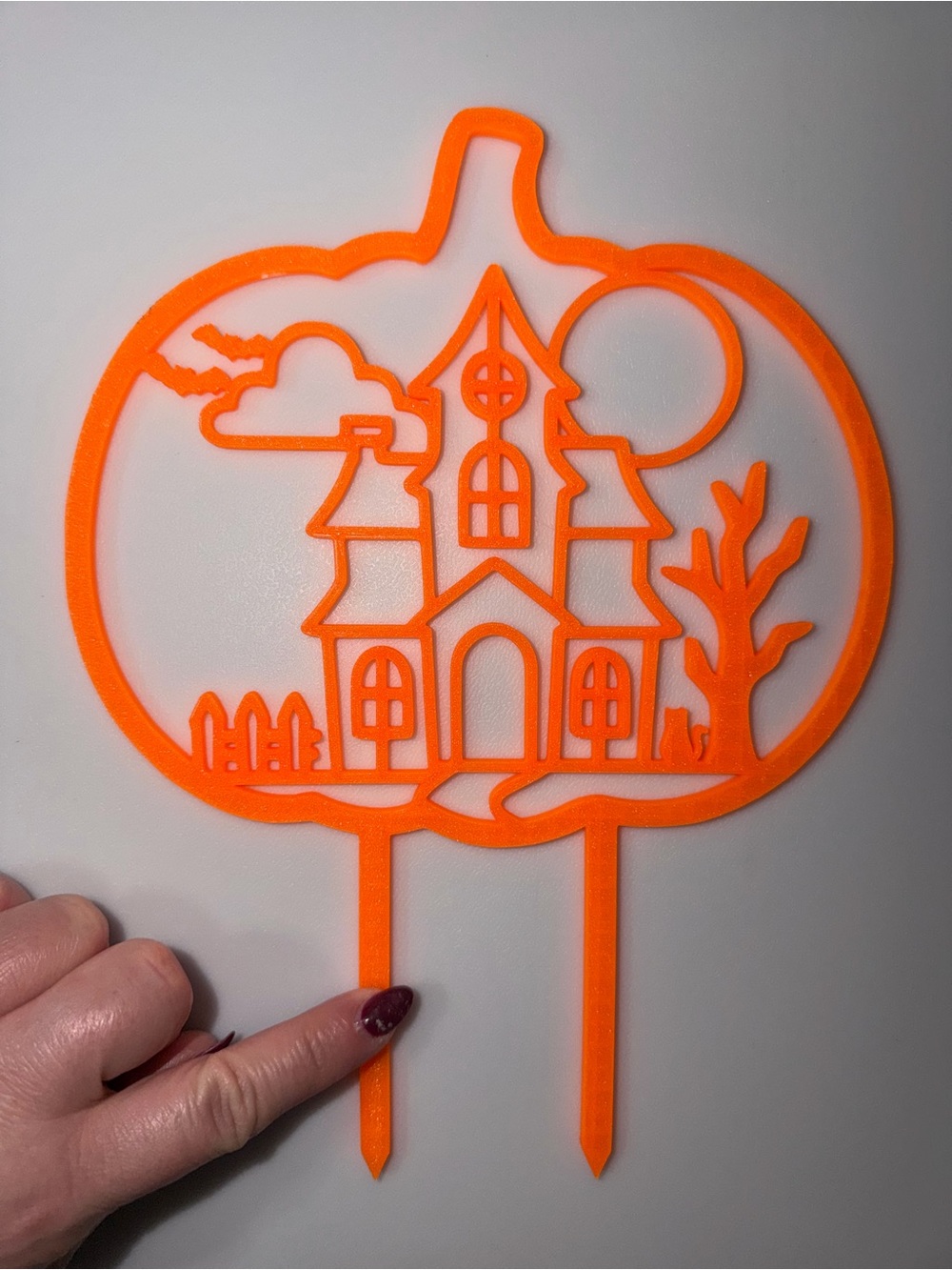 Halloween haunted house pumpkin shaped plant support trellis • neon orange